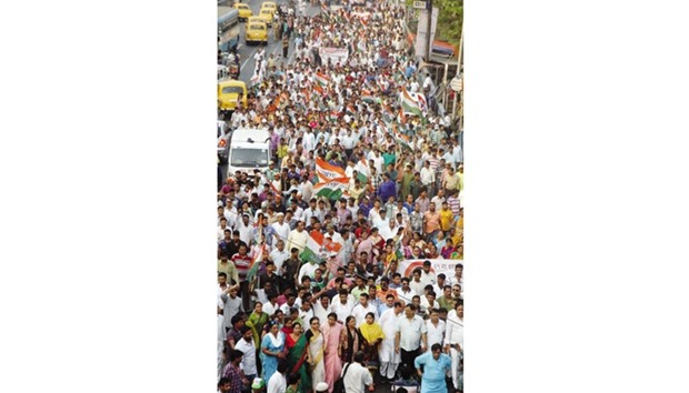 Trinamool Congress workers participate in a rally organised yesterday in Kolkata to protest the sting operation against party leaders. A news portal had carried out the sting operation which showed some party leaders receiving bribe money.