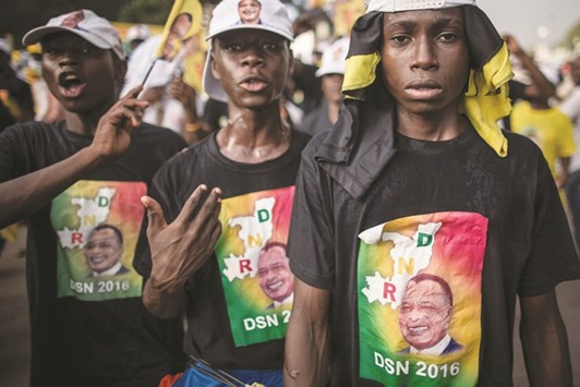 Supporters of incumbent Congolese President Sassou Nguesso are seen at the closing rally of his electoral campaign in Brazzaville yesterday, ahead of tomorrowu2019s presidential elections.