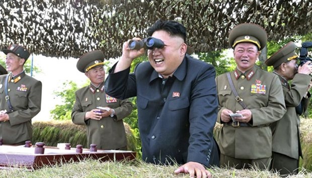 North Korean leader Kim Jong Un looks through a pair of binoculars in this file photo.
