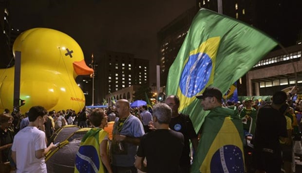 People protest in downtown Sao Paulo on Thursday. Protests have erupted in Brazil after a recorded phone call between President Dilma Rousseff and her once-popular predecessor was released.