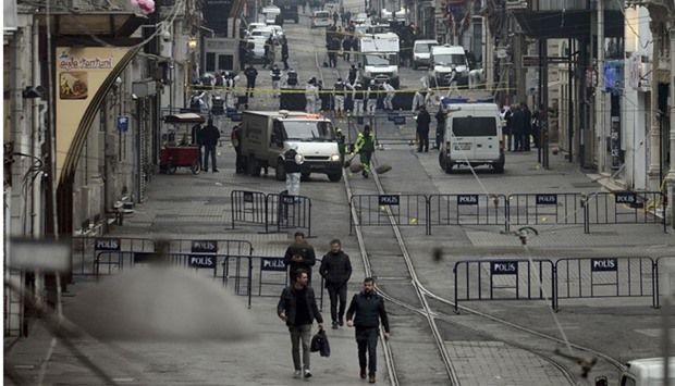 Police forensic experts inspect the area after a suicide bombing occured in a major shopping and tourist district in central Istanbul, Turkey. Reuters