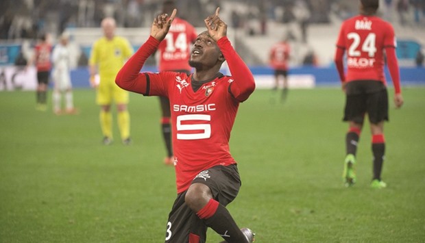 Rennesu2019 Ivorian forward Giovanni Sio celebrates after scoring during the Ligue 1 match against Marseille at the Velodrome stadium in Marseille. (AFP)