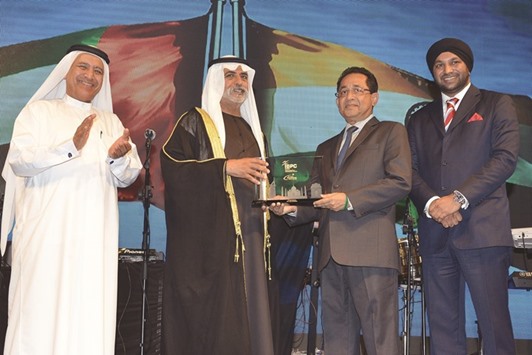 Joy Alukkas receiving the award at the ceremony in Dubai.