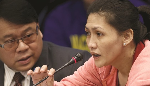 Maia Santos Deguito (right), branch manager of the Rizal Commercial Banking Corp, testifies during a Senate hearing of money laundering involving the theft of $81mn from the US account of the Bangladesh Bank, at the Philippine Senate in Manila.