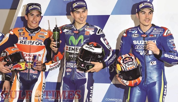 Pole-setter Jore Lorenzo (C),  second-placed Marc Marquez (L) and third-placed  Maverick Vinales pose after qualifying for todayu2019s Commercial Bank Grand Prix of Qatar. Pictures: Noushad Thekkayil and agencies.