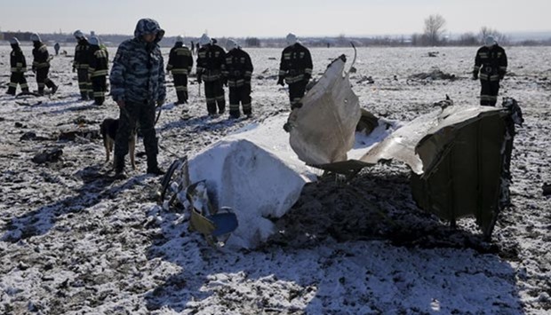 Emergencies Ministry members work at the crash site of a Boeing 737-800 Flight FZ981 operated by Flydubai, at the airport of Rostov-On-Don, Russia, on Sunday.