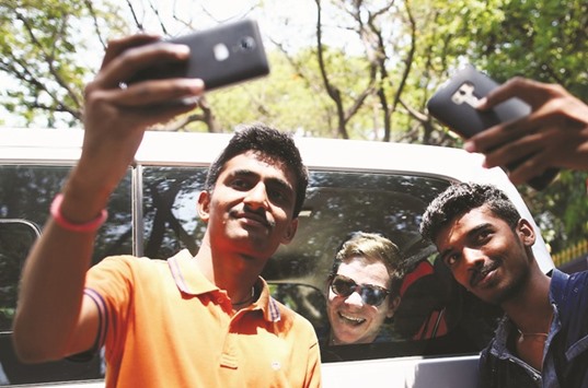 Australian captain Steven Smith (centre) poses for a photograph with fans in Bangalore. (AFP)