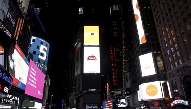 The One Times Square building, in the centre of Times Square, is darkened for Earth Hour in New York