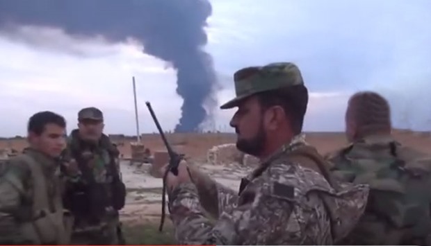 Syrian regime fighters on the outskirts of the Palmyra military airport