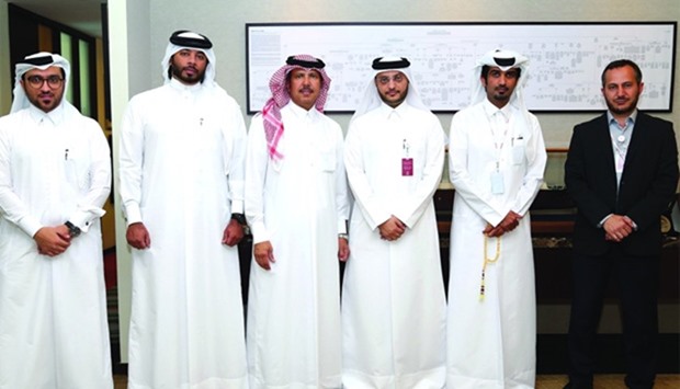 Officials from Qatar Charity and ExxonMobil Qatar