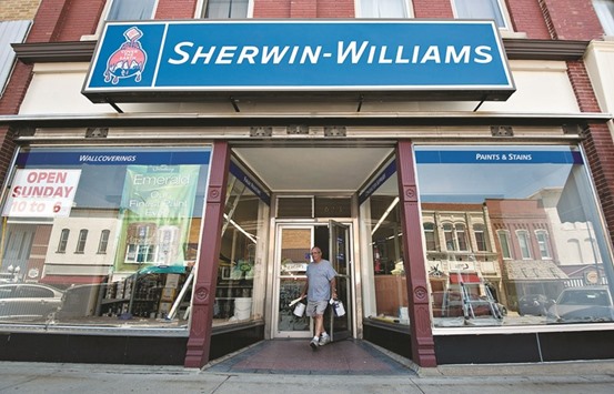 A customer leaves a Sherwin-Williams store in Princeton, Illinois. Valspar will help Sherwin-Williams expand in the Asia Pacific region and Europe, Sherwin-Williams CEO John Morikis said in an interview yesterday.