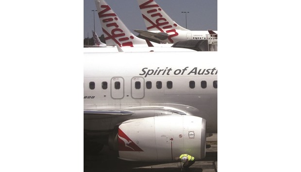Two Virgin Australia planes sit on the tarmac at Adelaide Airport. The Australian airline said it secured a A$425mn ($323mn) 12-month loan facility with its four major shareholders, as part of a structural review.