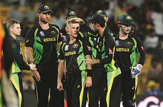 Australian spinner Adam Zampa (centre) celebrates with team-mates after dismissing Shuvagata Hom of Bangladesh during the ICC World Twenty20 match at the Chinnaswamy stadium Bangalore.