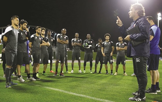 Qatar coach Daniel Carreno addresses his team during a training session in Doha yesterday.
