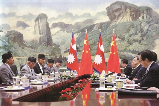 Nepal Prime Minister Khadga Prasad Sharma Oli meets Chinese President Xi Jinping at the Great Hall of the People in Beijing yesterday.