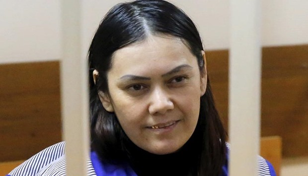 Gyulchekhra Bobokulova, a nanny suspected of murdering a child in her care, sits inside a defendants' cage as she attends a court hearing in Moscow on Wednesday.