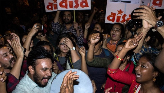 Indian students and activists shout slogans as they celebrate the release of the Indian student from