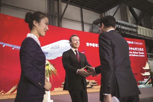 Airbus CEO Fabrice Bregier (centre) leaves the stage after delivering a speech during a ceremony to mark the beginning of construction on a new Airbus facility in Tianjin yesterday.