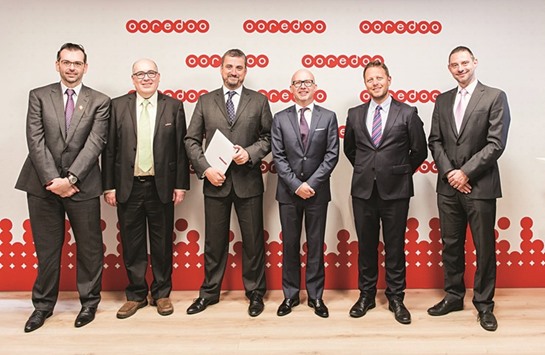 Ooredoo and Si teams following the agreement signing at the Mobile World Congress in Barcelona.