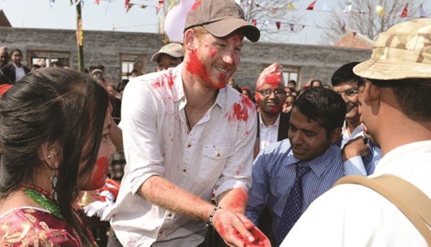 Prince Harry joins in the celebrations of the festival of colours in Nepal.