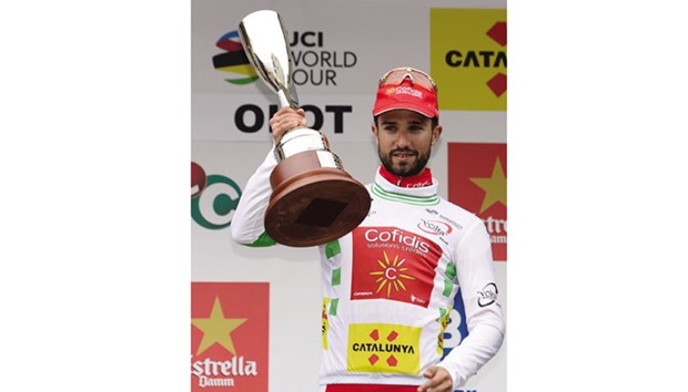French rider Nacer Bouhanni celebrates on the podium after winning the second stage of the Tour of Catalonia race in Olot. (AFP)