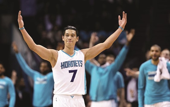 Jeremy Lin #7 of the Charlotte Hornets reacts after making a basket against the San Antonio Spurs during their game at Time Warner Cable Arena in Charlotte, North Carolina.