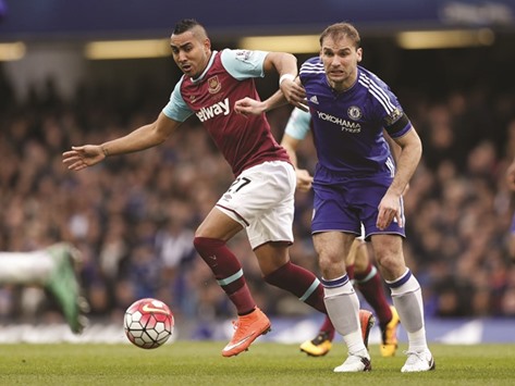 West Hamu2019s Dimitri Payet (left) vies for the ball with Chelseau2019s Branislav Ivanovic during their English Premier League match at Stamford Bridge in London on Saturday. (Reuters)