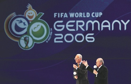 In this December 9, 2005, picture, German football legend Franz Beckenbauer (left) and the then FIFA president Sepp Blatter share the stage ahead of the final draw of the FIFA World Cup 2006 in Leipzig. (AFP)