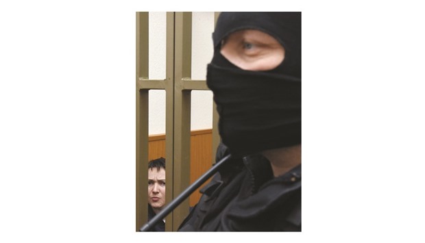Savchenko is seen inside a defendantu2019s cage during her sentencing hearing at a court in the southern Russian town of Donetsk.