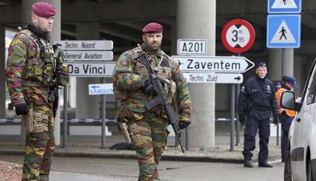 Belgian troops man a roadblock near Brussels' Zaventem airport on Wednesday following Tuesday's bomb attacks.