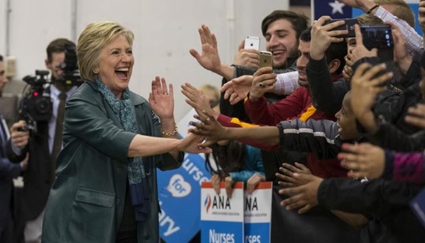 Hillary Clinton greets supporters during a rally at Rainier Beach High School in Seattle, Washington.