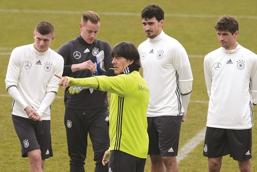 Germanyu2019s head coach Joachim Loew talks to his players Toni Kroos, Marc-Andre ter Stegen, Mats Hummels and forward Thomas Muller during a training session in Berlin yesterday. (AFP)