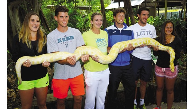 (From left) Belinda Bencic of Switzerland, Dominic Thiem of Austria, CoCo Vandeweghe and Pablo Carreno Busta of Spain, Leonardo Meyer of Argentina and Monica Puig of Puerto Rico pose during a sight-seeing trip to Jungle Island, while taking some time off from the Miami Open being played in Key Biscayne, Florida. (AFP)