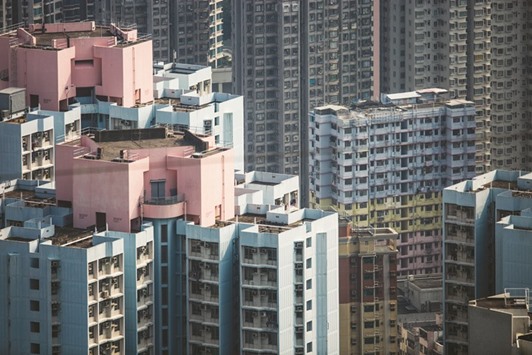 Residential buildings are seen in Hong Kong. After a 34% selloff from its June peak through January 21, the Hang Seng Properties Index has jumped 18% in just two months, outpacing the broader Hong Kong equity market by almost 7 percentage points.