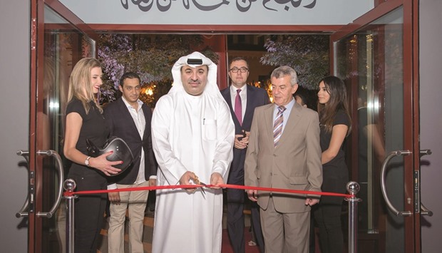 Omar Hussain Ibrahim Alfardan, president and CEO of the Alfardan Group Holding Co, cutting the ribbon to inaugurate the showroom.