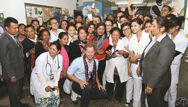 Prince Harry poses with staff at Kanti Childrenu2019s Hospital in Kathmandu.