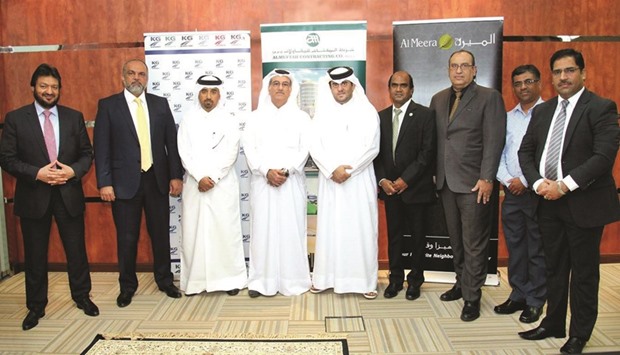 Al Meera officials with other stakeholders after the signing ceremony.