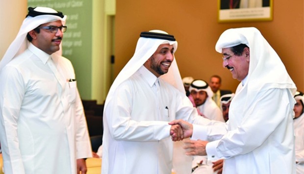 HE Dr Hamad bin Abdulaziz al-Kuwari with Dr Hassan Rashid al-Derham and Dr Khalid al-Khanji.