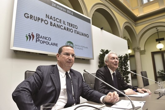 Banca Popolare di Milano (BPM) chief executive Giuseppe Castagna (left) and Banco Popolareu2019s (BP) chief executive Pier Francesco Saviotti attend the BP-BPM merger project presentation in Milan yesterday. The merged bank, to be headquartered in Milan and Verona, will have around u20ac171bn in assets, 2,500 branches and more than 25,000 staff u2014 making it the countryu2019s third biggest lender behind Intesa Sanpaolo and UniCredit.