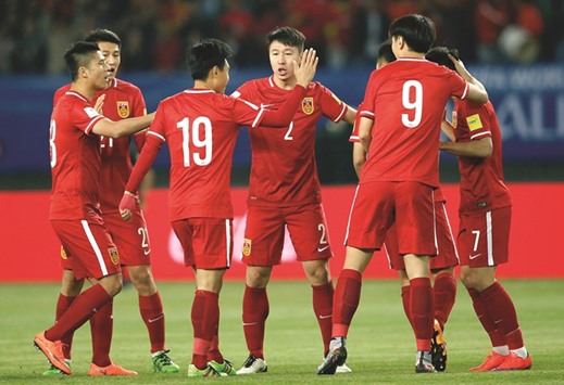 Chinau2019s players celebrate after scoring a goal during a 2018 World Cup qualifying match against Maldives in Wuhan yesterday. (AFP)