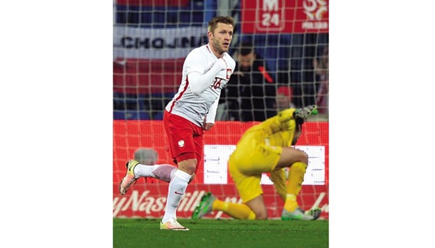 Polandu2019s Jakub Blaszczykowski reacts after he scored a goal against Serbia during their friendly in Poznan. (AFP)
