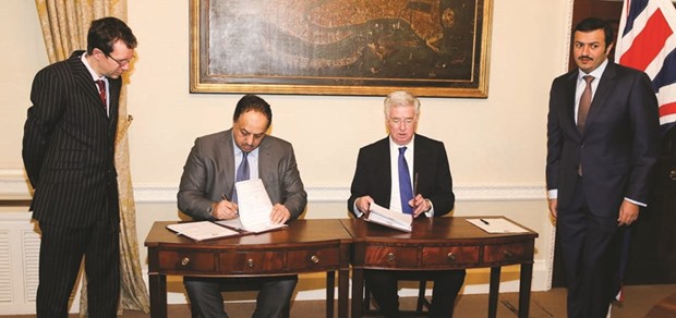 HE the Minister of State for Defence Affairs Dr Khalid bin Mohamed al-Attiyah and the UK Secretary of State for Defence Michael Fallon signing the agreement in London yesterday.
