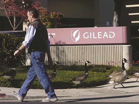 A man walks past Gilead Sciences offices in Foster City, California (file). Merck is trying to catch up to Gilead, which dominates the market on a new generation of hepatitis C drugs that can cure well over 90% of patients with the liver disease.
