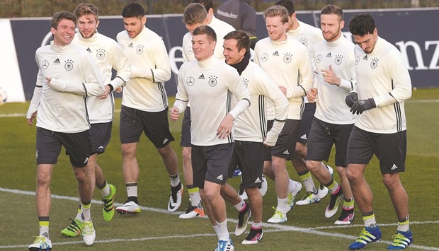 Germany national football team players warm up ahead of a training session in Berlin on the eve of their friendly against England. (AFP)