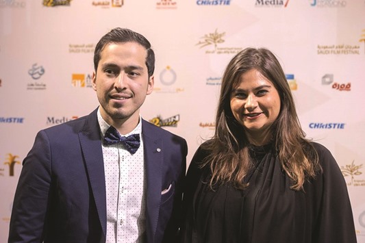 Saudi filmmaker Ayman al-Khoja (left) arrives at the opening ceremony of the film festival in Dammam.