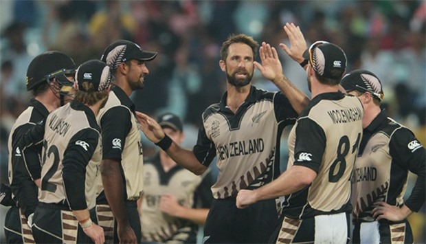 New Zealand's Grant Elliott(C)celebrates with teammates