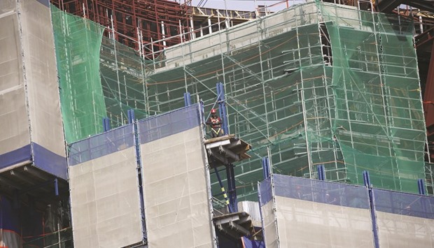 A worker is seen at a construction site in Seoul. Construction investment in South Korea fell 2.4% during the October-December period from the previous quarter, according to the revised gross domestic product data released on Friday.