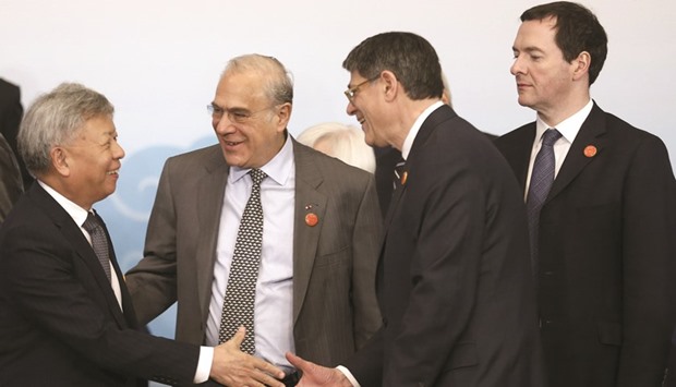 From left: President of Asian Infrastructure Investment Bank Jin Liqun; secretary general of the Organisation for Economic Co-operation and Development Angel Gurria; US Secretary of the Treasury Jack Lew and Britainu2019s Chancellor of the Exchequer George Osborne attend a group photo session during the G20 finance ministers and central bank governors meeting in Shanghai (file).