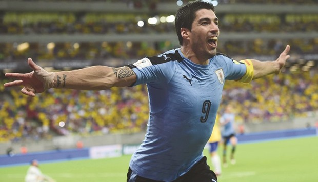 Uruguayu2019s Luis Suarez celebrates after scoring against Brazil during their World Cup South American qualifying clash in Recife on Friday.