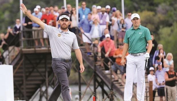 Louis Oosthuizen of South Africa (L) and Jordan Spieth of the United States react to the tee shot of Spieth on the 13th hole during the round of 16 in the World Golf Championships-Dell Match Play at the Austin Country Club in Austin, Texas, yesterday. (Getty Images/AFP)